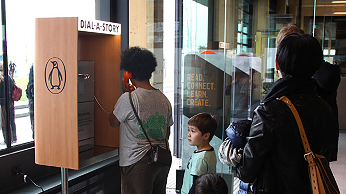 Picture of users interacting with Dial-A-Story phone booth1